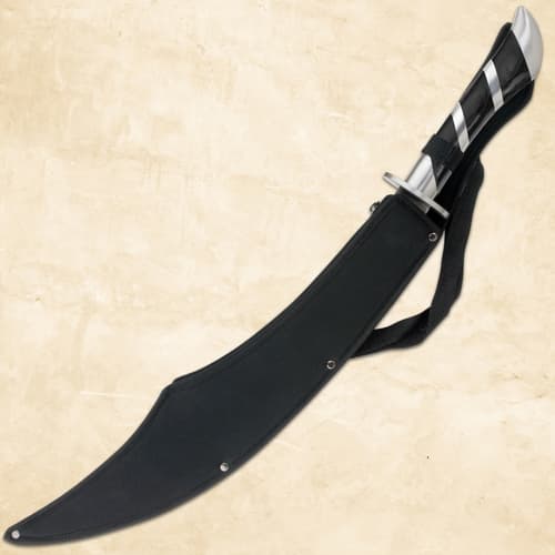 Scimitar in black sheath on beige background
