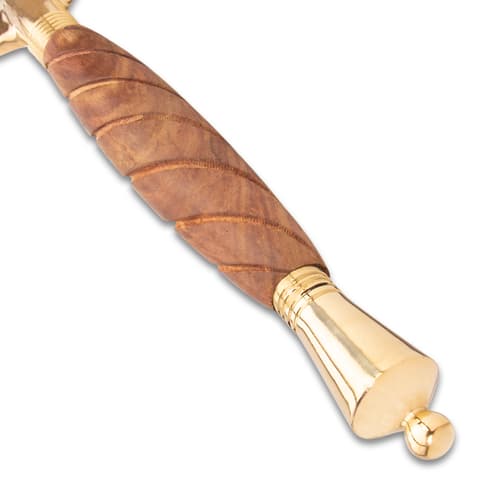 Close-up of a wooden spiral handle with brass pommel