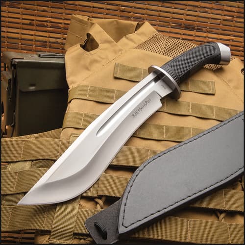 Bowie knife on tactical gear with sheath