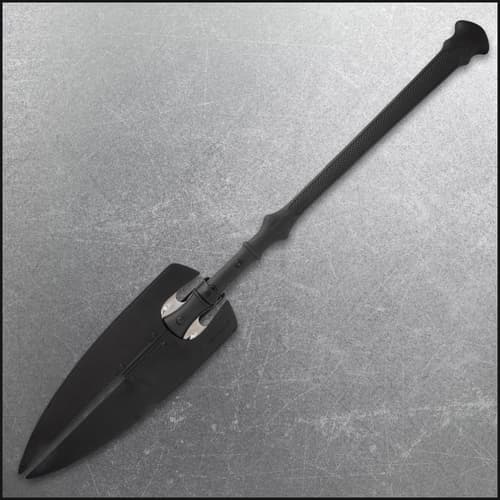 Spear sheathed in black leather on textured background