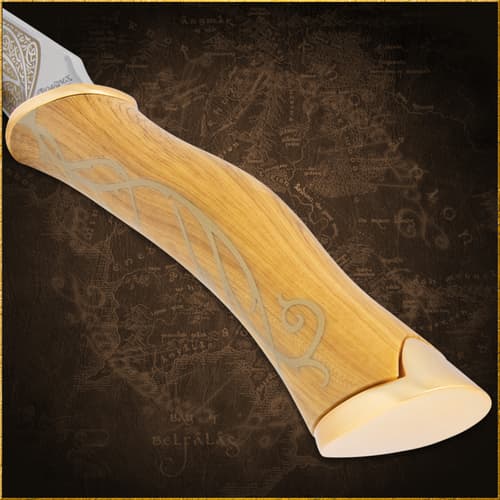 Close-up of a wooden knife handle with vine motif
