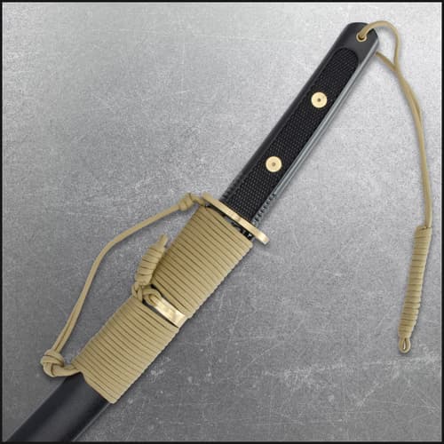 Tanto in scabbard showing handle details and paracord wrap