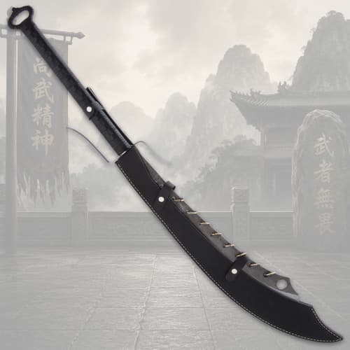 Sword sheathed in black scabbard with mountain backdrop