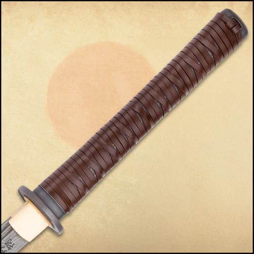 The handle is wrapped in genuine brown leather.