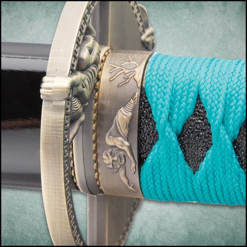 The 39” katana has a Damascus steel blade and teal cord wrapped handle with cast metal details.