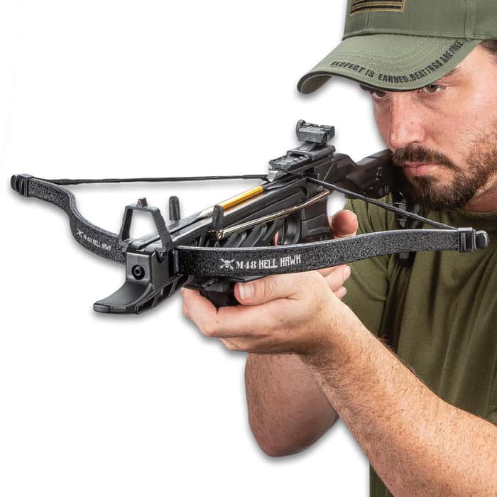 cocking a crossbow by hand