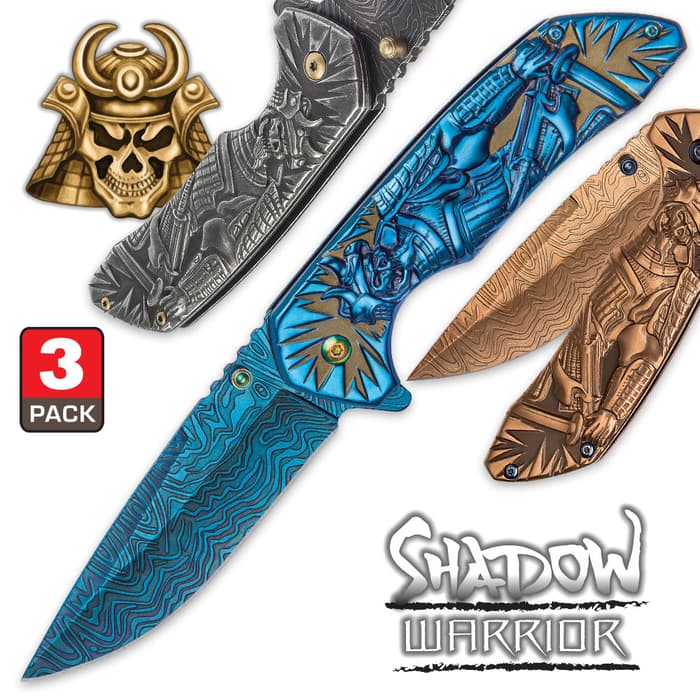 Shadow Warrior Pocket Knife Collection showcases three knives, one silver, one blue, and one gold, all of which have intricate warrior handles.