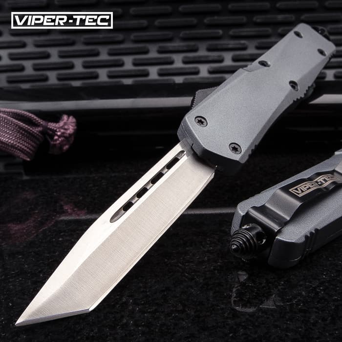 Ghost Series Grey Tanto Knife has a tanto style blade and grey metal alloy handle, shown on black background.