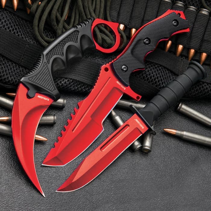 Black Legion Red Fury Triple Knife Set has a 7 1/2” karambit, 8 1/2” huntsman, and 7 1/2” military knife, all with red blades and black handles.