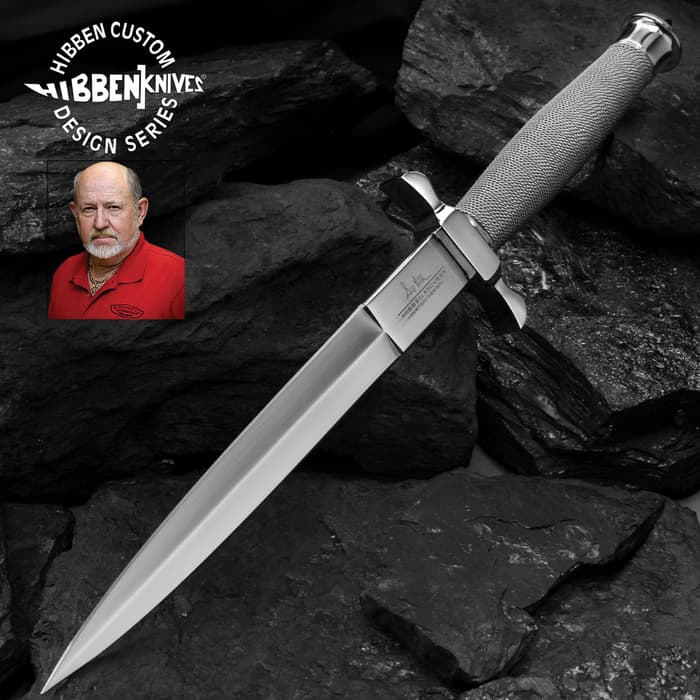 Gil Hibben Silver Shadow Dagger Knife has a 420 stainless steel blade and silver wire-wrapped hilt, shown on black rock background.