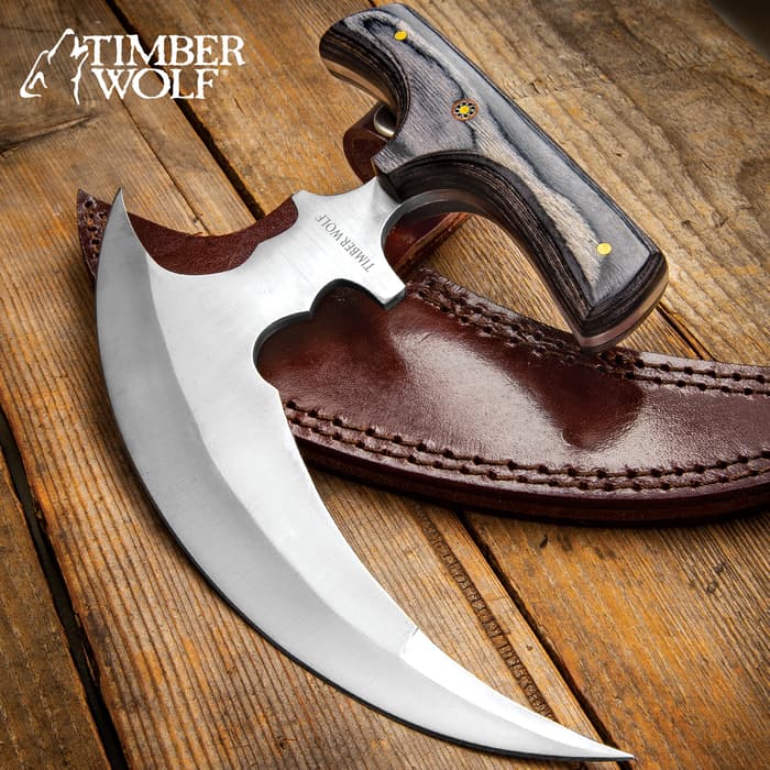 Timber Wolf Reaper Urban Ulu shown with 7 3/4" stainless steel scythe blade and grooved black wooden handle with rosette accent.