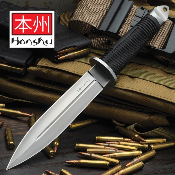 United Cutlery Honshu Fighter Knife has a 440A stainless steel blade and rubberized grip, shown on background of tactical gear.