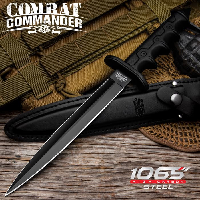 Combat Commander V42 Stiletto Dagger has a 1065 black carbon steel dagger blade and cast aluminum handle, shown on wooden background.