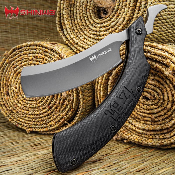 Shinwa Kamisori Folding Razor Knife has a stainless steel blade and black G10 handle scaled with Kanju etched on one side.