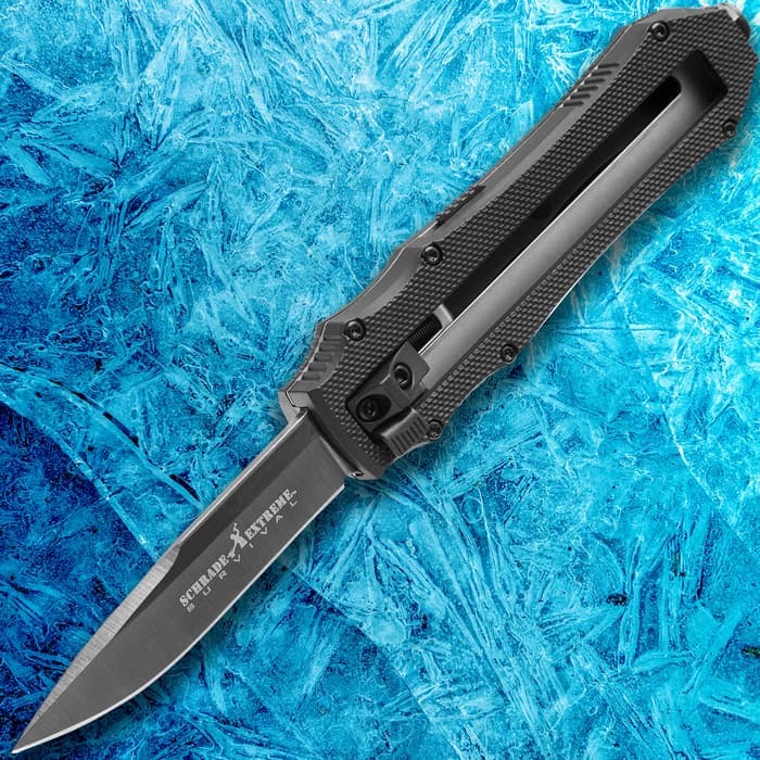 Schrade Extreme First Generation OTF Assisted Opening Knife is all black with a 4116 stainless blade that ejects from the front.