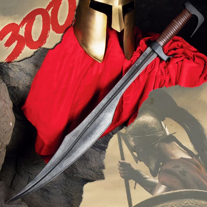 300 Spartan Warrior Replica sword shown alongside gold spartan helmet and red garment.  