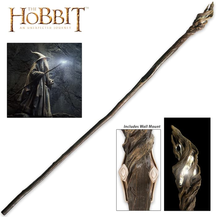 The Hobbit Staff of the Wizard Gandalf shown held by the character, in full, and with detailed look at the LED light at the end of the staff. 