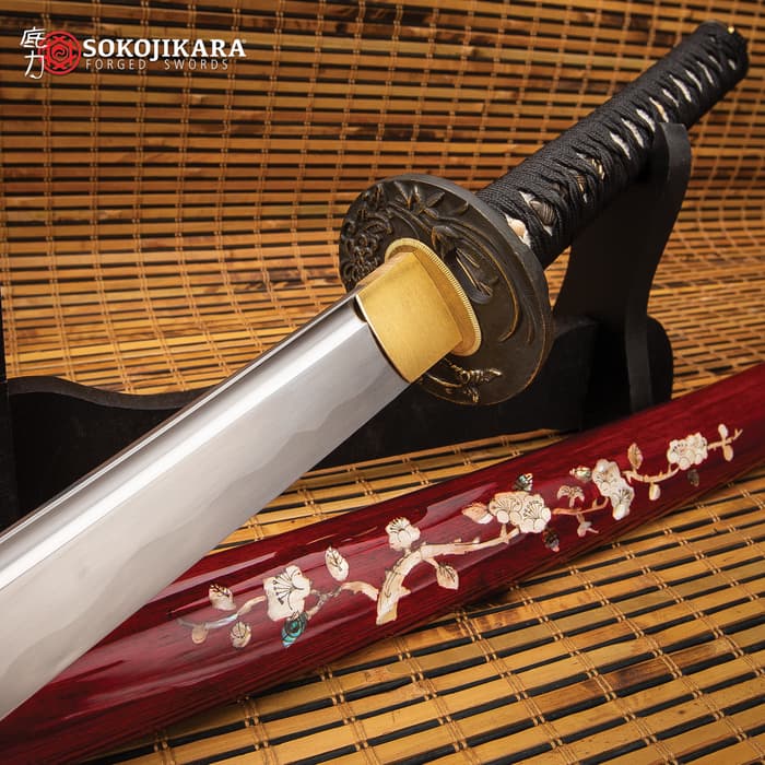 Sokojikara Silk Wrapped Bamboo Blossom Katana shown with blossom adorned scabbard on a tatami mat. 