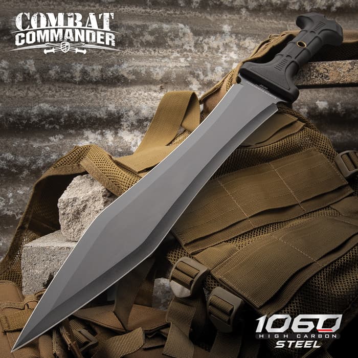 Combat Commander gladiator sword with black 1060 high carbon steel blade laid on top of tactical gear. 