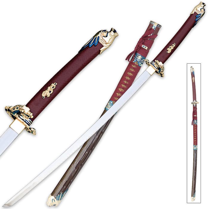 Oda Nobunaga red katana shown with ornate tsuba and pommel and with detailed scabbard wrapped in red cord. 