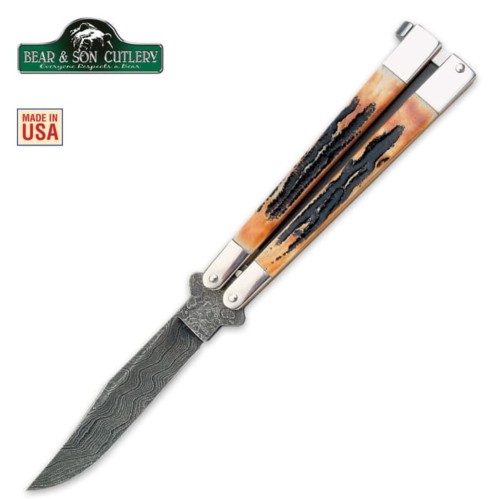 Bear India Stag Bone Butterfly Damascus Blade has a 3 3/8” 512-layer Damascus steel hollow ground blade and India stag bone handles.