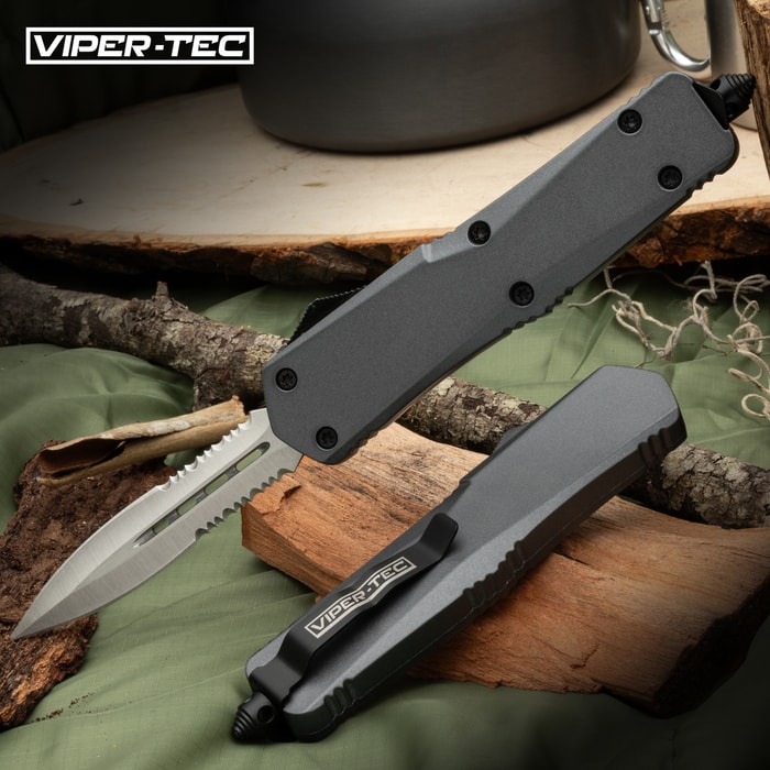 The Viper-Tec Ghost Series Grey Half-Serrated OTF Knife is perfect for those of you who want to carry a full-size knife without the extra bulk but that is still built for hard use