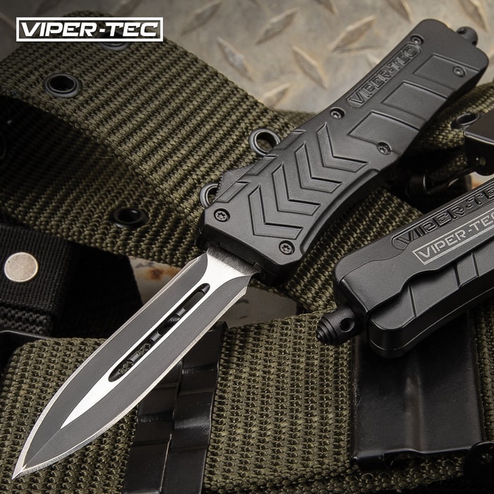 The Medium VF-1 Series Black Double Edge OTF Knife has a 3 1/4" stainless steel two-tone blade and black metal alloy handle.