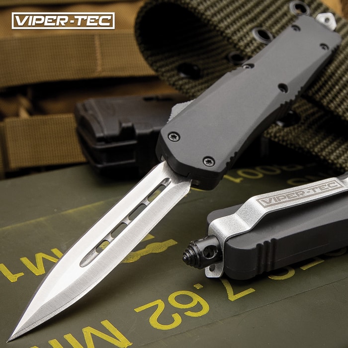 The Mini Ghost Series Black Double Edge OTF Knife has a 2 3/4" stainless steel blade and tough black handle, shown on tactical background.