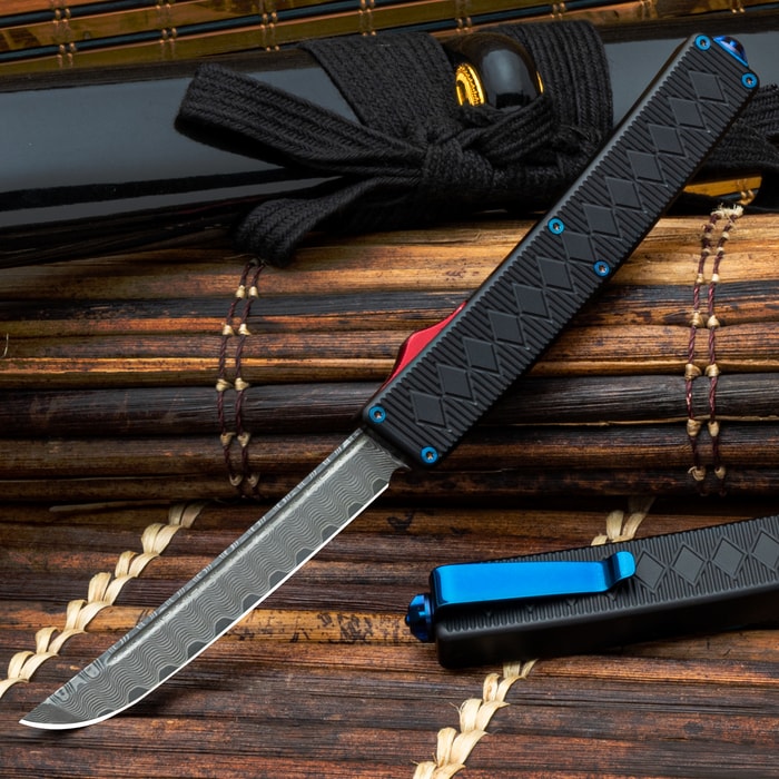 The Double-Action OTF Knife shown open and closed