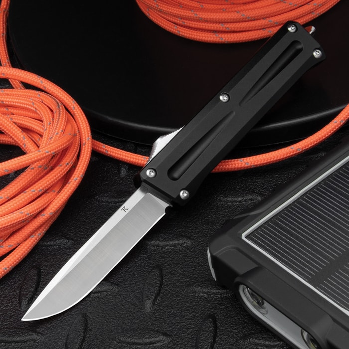The TacKnives TK PRO Mini OTF Stinger Knife shown deployed