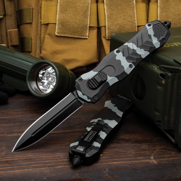 The Armed Force Urban Camo Automatic OTF Knife shown in an open and a deployed position