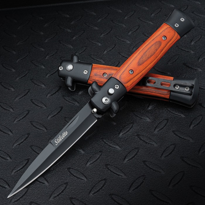 The Gangster's Edge Automatic Stiletto Pocket Knife, with its 3 7/8" black coated stainless steel blade and wood inlaid handle, displayed both opened and closed on a black background.
