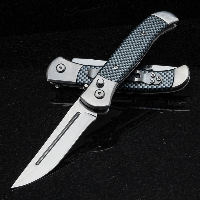 The Quick Silver Automatic Knife is shown both opened and closed with 3.5” stainless steel blade and textured carbon fiber handle.