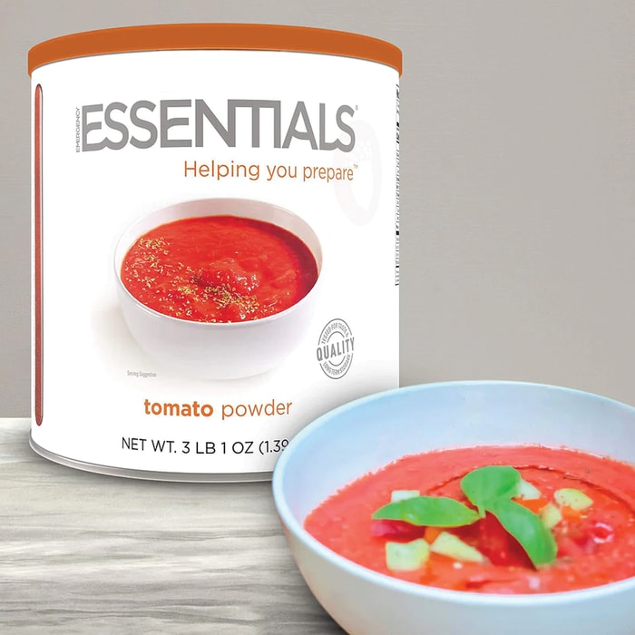 The Emergency Essentials Tomato Powder shown in its can and reconsituted in a bowl