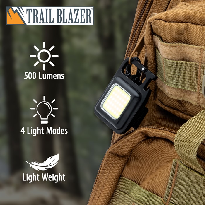The Trailblazer Rechargeable Key Chain Light attached to a backpack