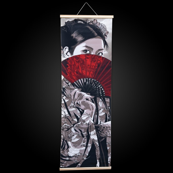 This samurai girl wall art shows a beautiful Japanese lady hiding behind a fan, When looking through the fan you see her face as a skull. 
