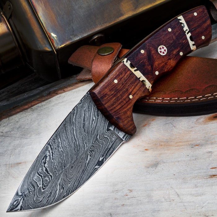 A view of the Timber Wolf Rough Rider Knife with its sheath