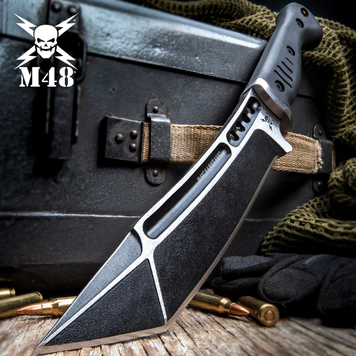M48 Sabotage Tanto Fighter Knife has a 8” cast stainless steel blade with black oxide coating and injection molded TPR handle.