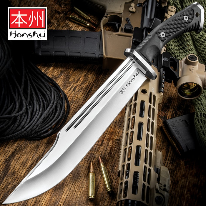 The Honshu Conqueror Bowie Knife has a 10 7/8” 7Cr13 stainless steel blade with blood grooves and textured TPR handle, shown on tactical background.