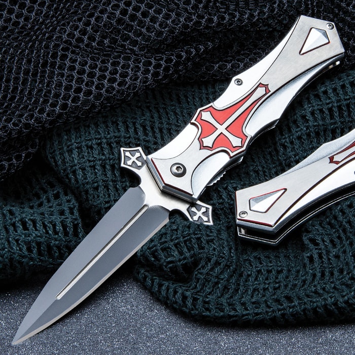 Crusaders Aluminum Assisted Opening Pocket Knife has a 4” two-tone stainless steel blade and cross medallion on the handle.
