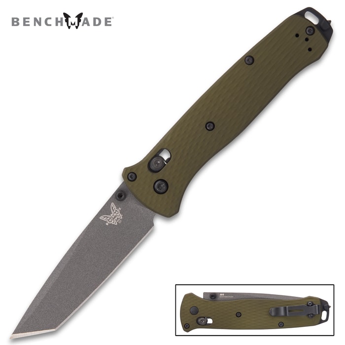 The knife has a grey-coated, 3 3/10” CPM-M4 steel tanto blade with a 62-64 HRC and thumbstuds for ease of access