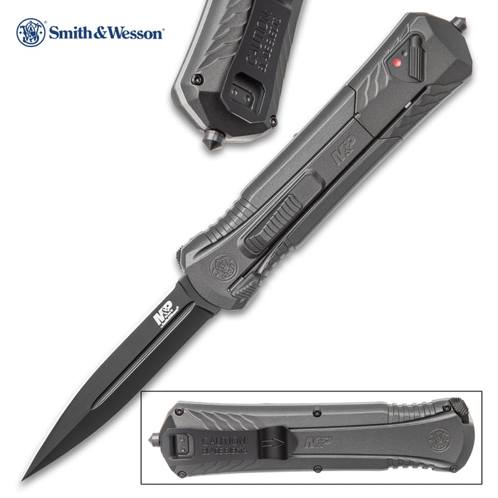 Dark matte grey pocket knife showing extended double edged blade with a tactical style handle. 
