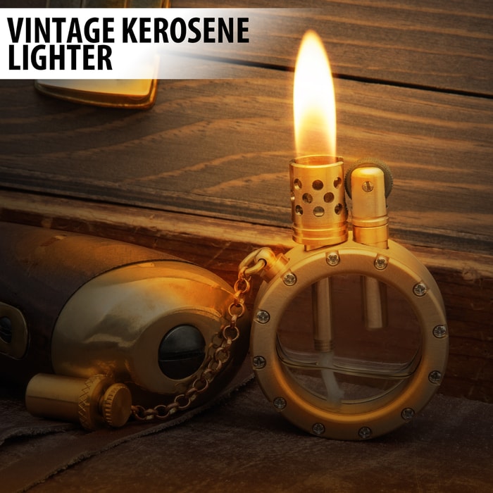 Vintage kerosene lighter with top off, set on wooden background, emitting flame.