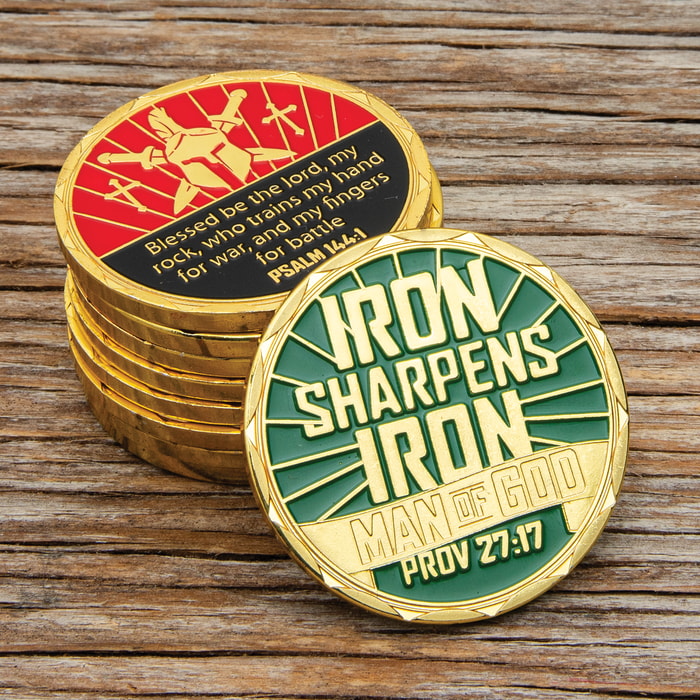Both sides of the Iron Sharpens Iron Challenge Coin on display