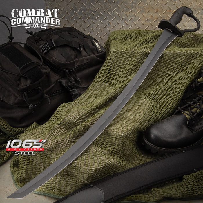 Combat Commander Saber Sword with black coated blade shown laying on tactical gear. 