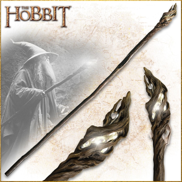 The Hobbit Staff of the Wizard Gandalf shown held by the character, in full, and with detailed look at the LED light at the end of the staff. 