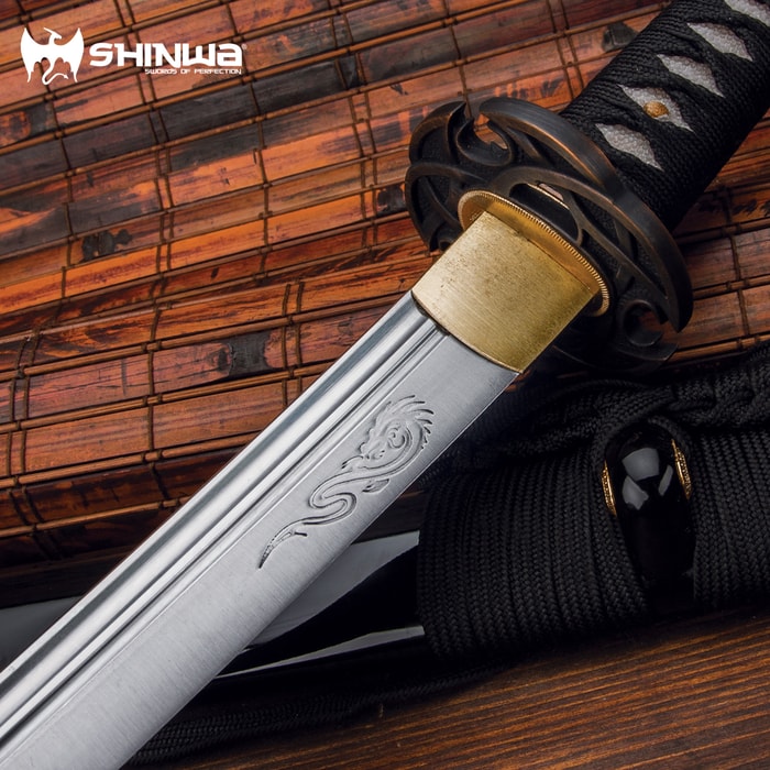 It has a hand-forged, 28 3/4” carbon steel blade
