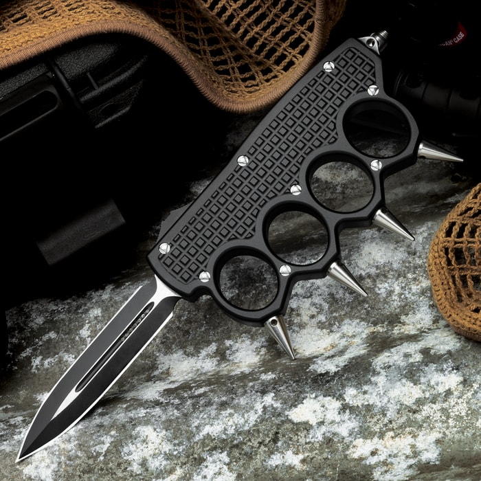 A view of the Spiked OTF Knuckle Knife in its deployed position