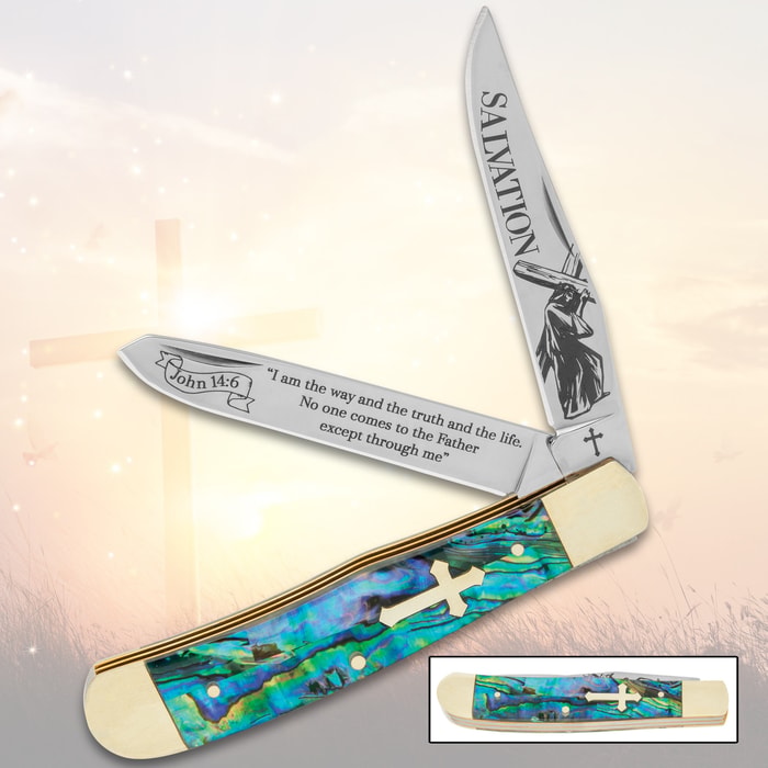 Pocket knife with abalone handle, cross inset, and etched blades