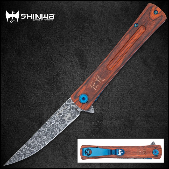 Slim open pocket-knife with bloodwood handle, metallic blue accents, and grey upswept blade with a raised raindrop pattern on a background of bamboo.
